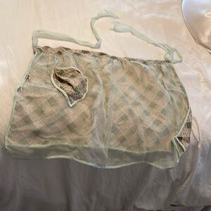 Light green dark green apron torn